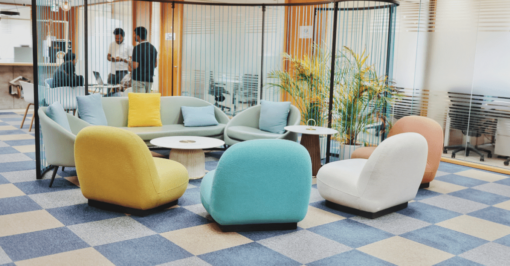 Modern coworking space in Dubai featuring vibrant, ergonomic seating, collaborative meeting areas, and a stylish, open-concept design.